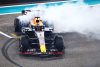 ABU DHABI, UNITED ARAB EMIRATES - NOVEMBER 26: Race winner Max Verstappen of the Netherlands driving the (1) Oracle Red Bull Racing RB19 performs donuts on track during the F1 Grand Prix of Abu Dhabi at Yas Marina Circuit on November 26, 2023 in Abu Dhabi, United Arab Emirates. (Photo by Clive Rose/Getty Images) // Getty Images / Red Bull Content Pool // SI202311260241 // Usage for editorial use only //